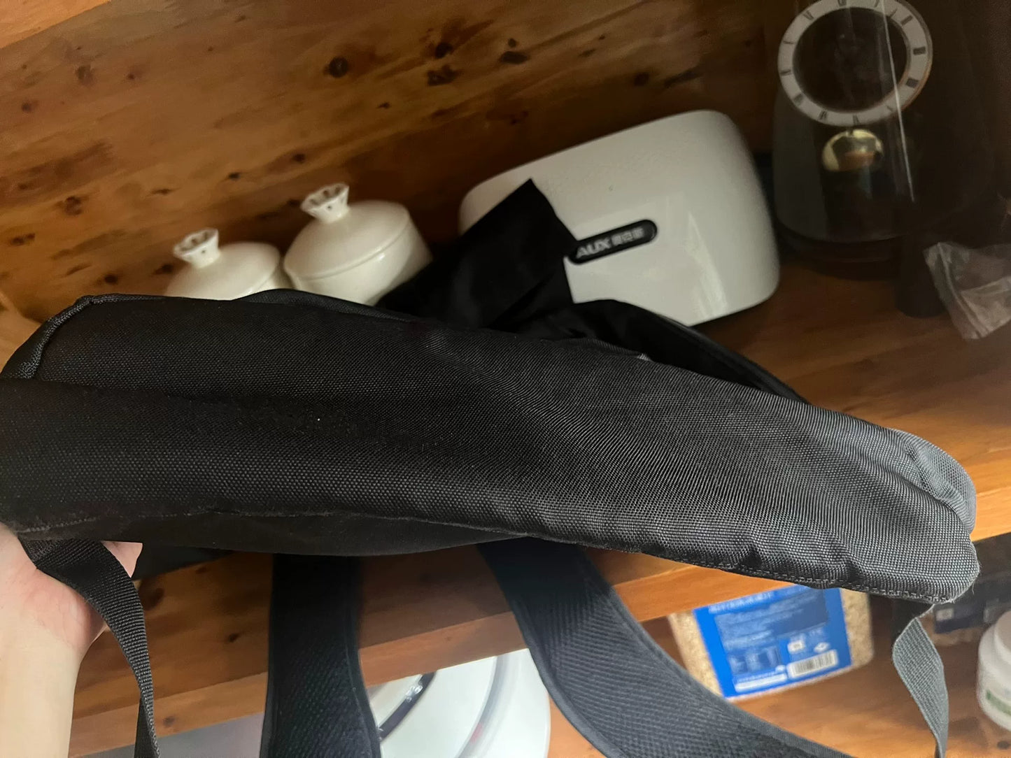 black roll-top backpack with multifunctional pockets