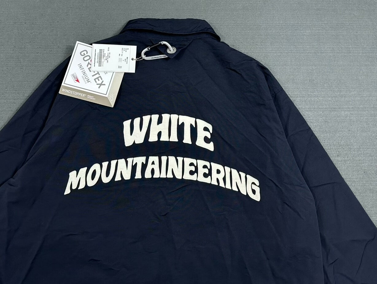 white mountaineering gore-tex coach jacket