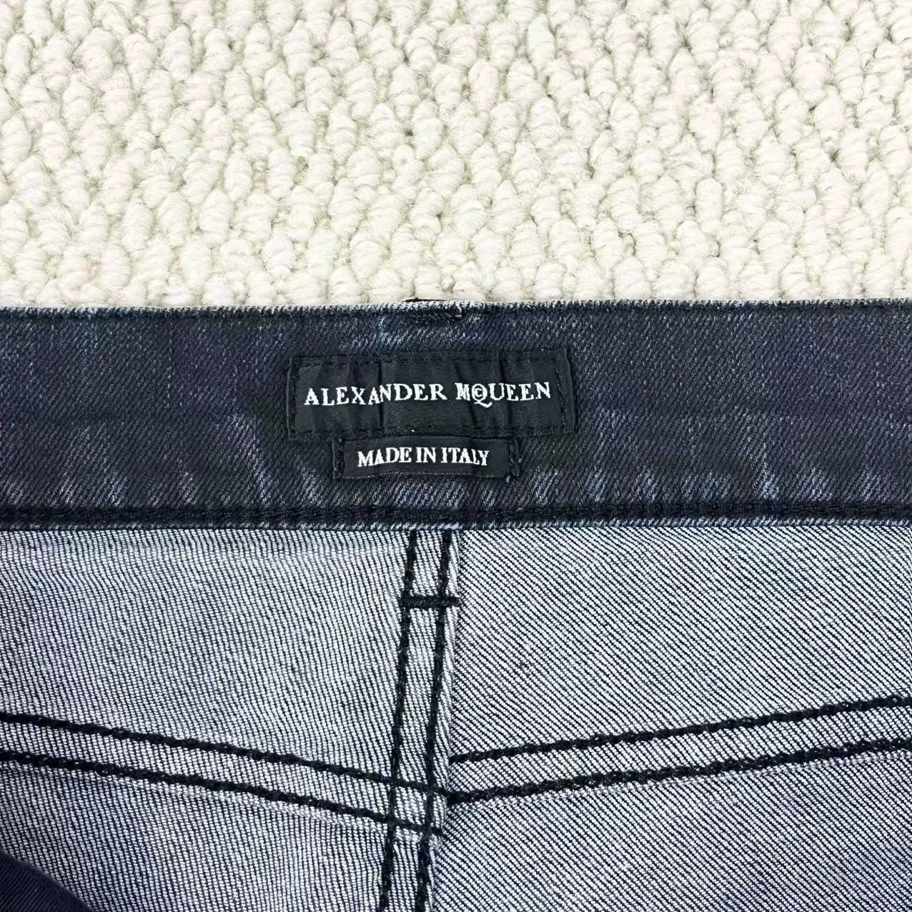 black distressed side-zip jeans by alexander mcqueen