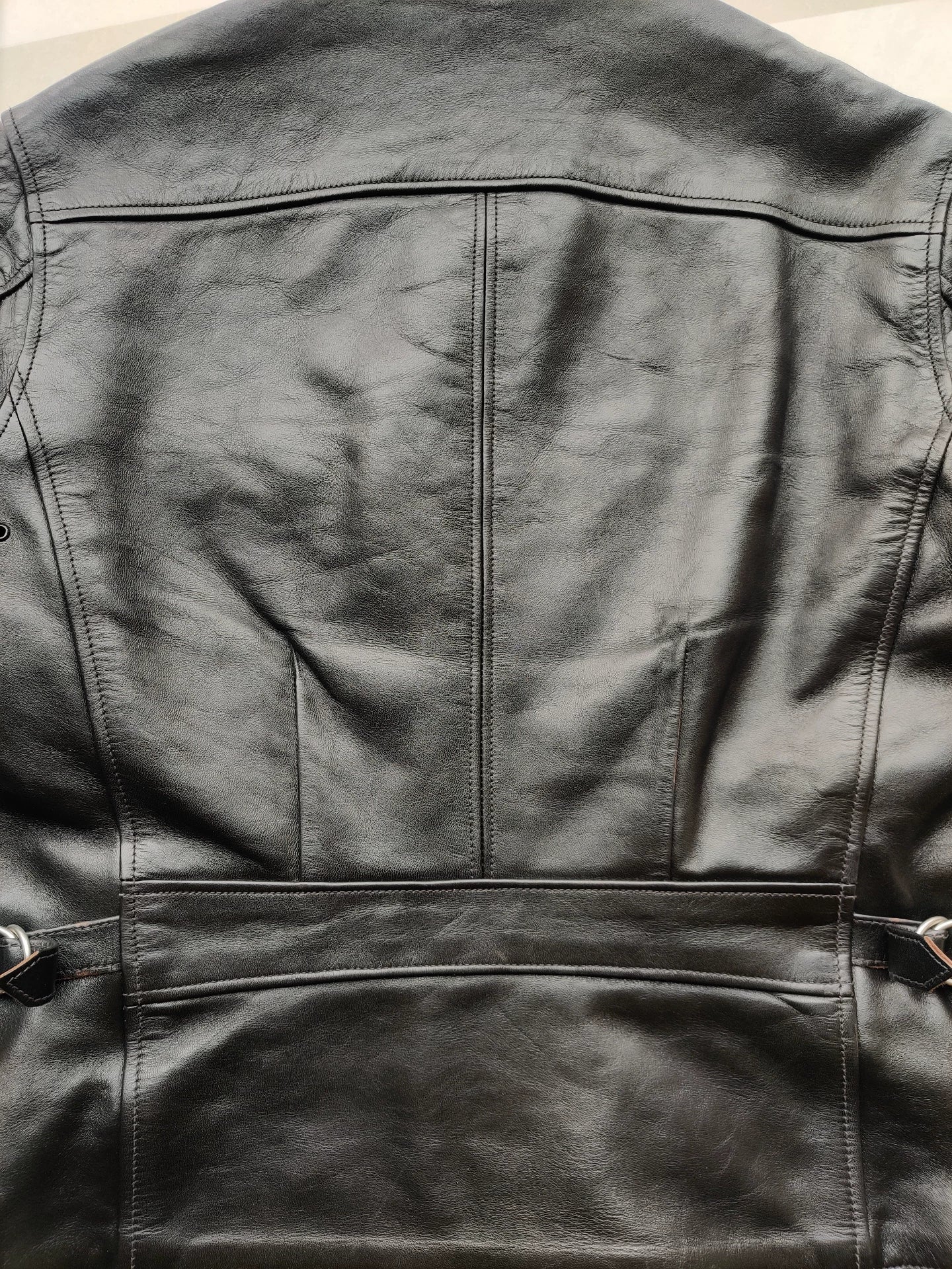 black leather jacket with snowflake pattern