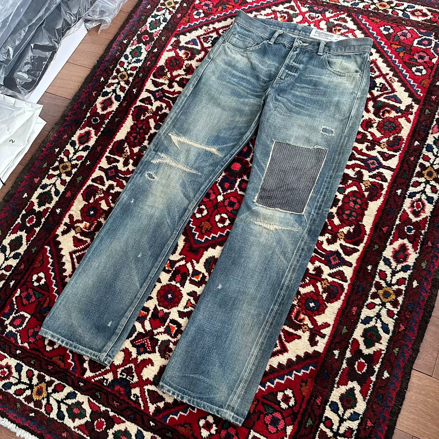 distressed blue jeans with unique detailing