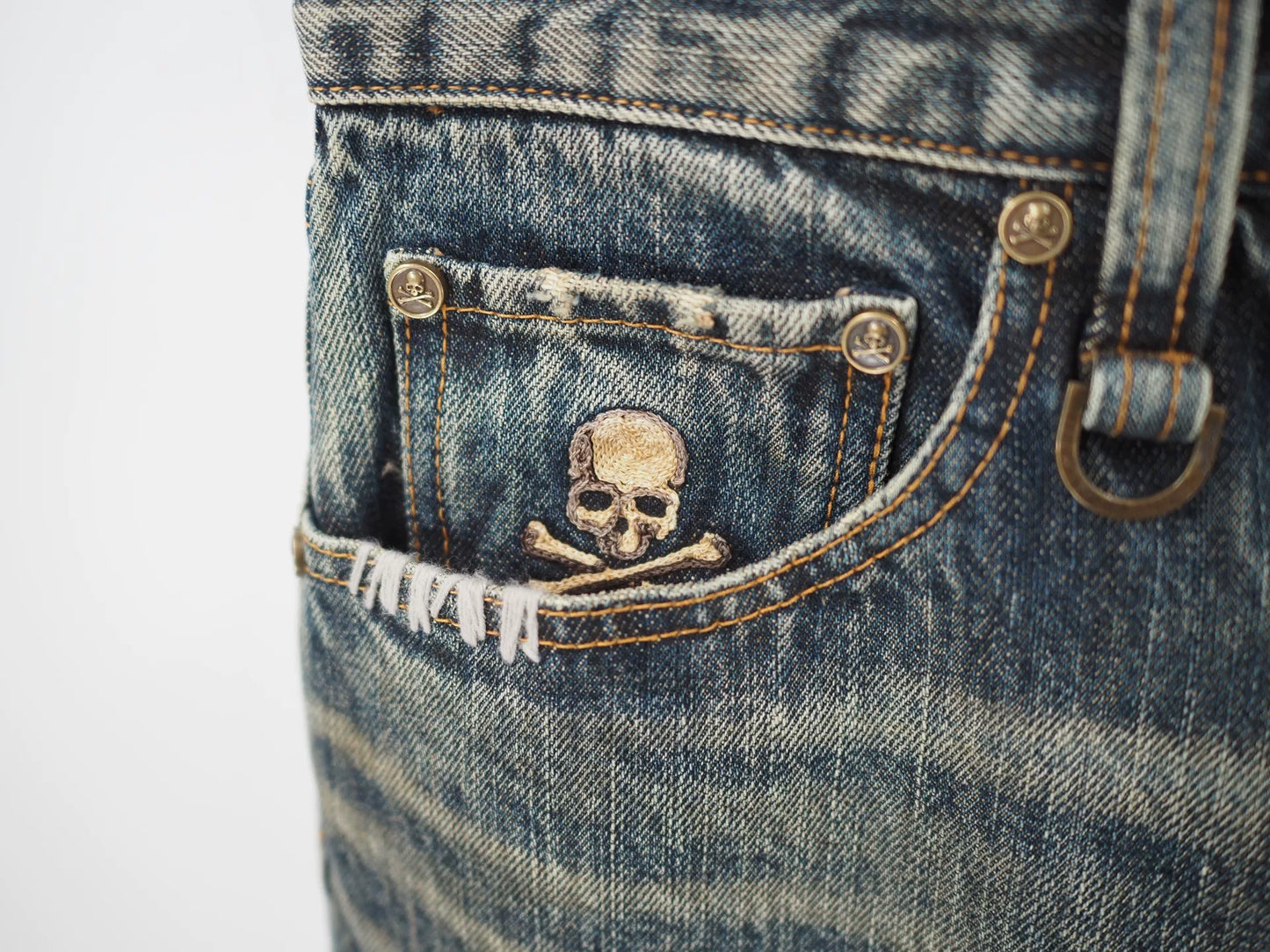 blue denim jeans with gold detail