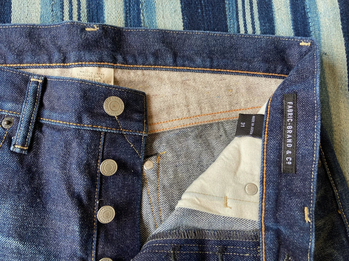 washed vintage-style raw denim jeans
