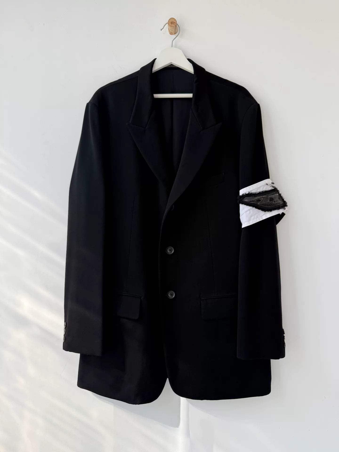 black wool suit jacket with white detail