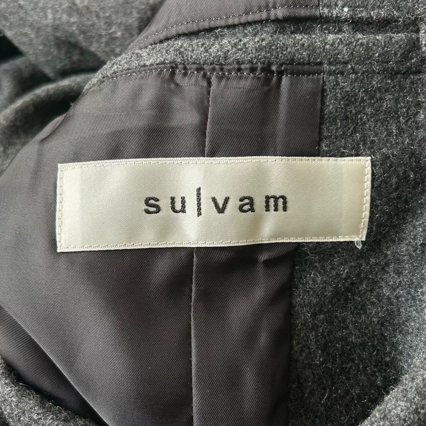 gray wool coat with studs by Sulvam