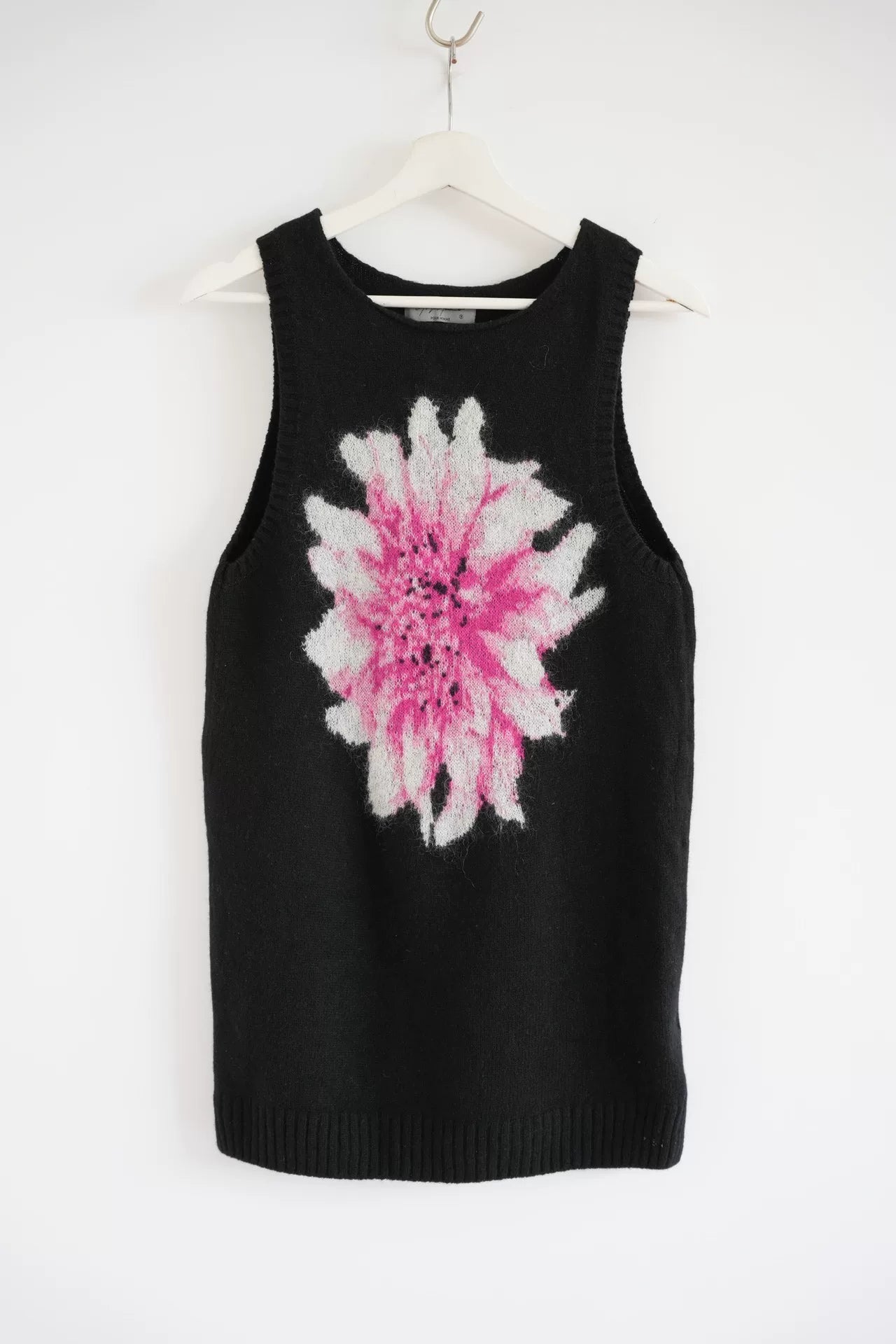 black sleeveless knit vest with floral design