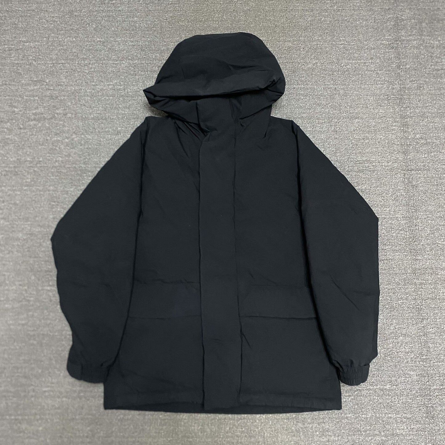 black waterproof puffer jacket by BEAMS