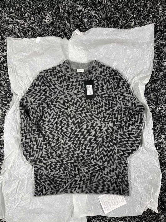 black and gray zigzag patterned sweater