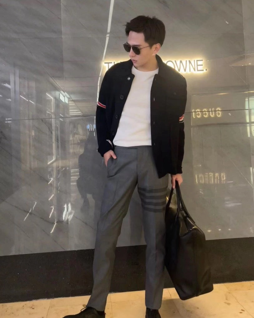 gray striped wool suit trousers by Thom Browne