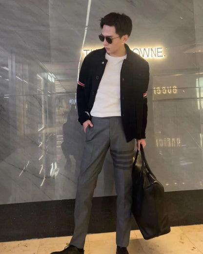 gray striped wool suit trousers by Thom Browne
