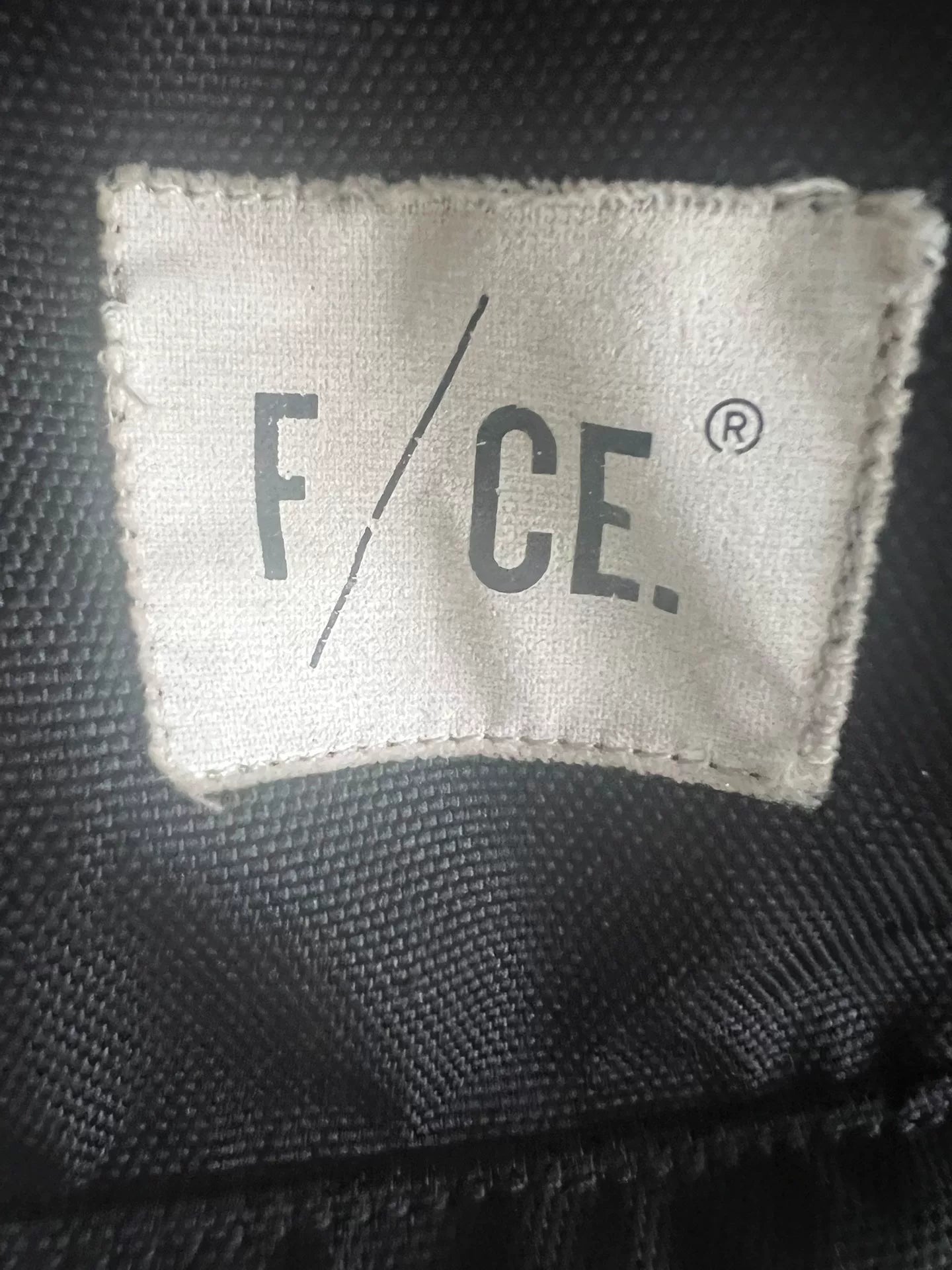 black roll-top backpack with multifunctional pockets