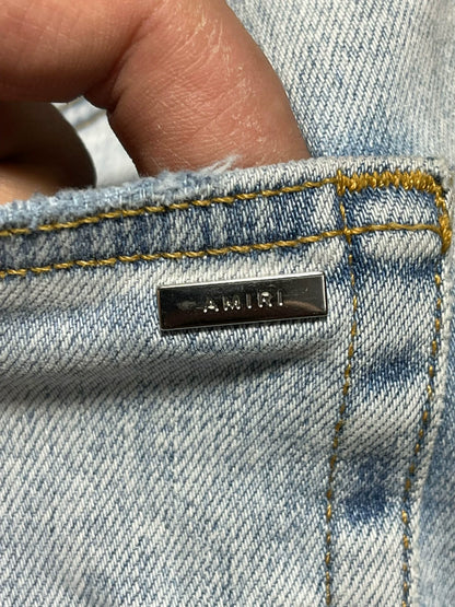 amiri mx1 distressed skinny jeans