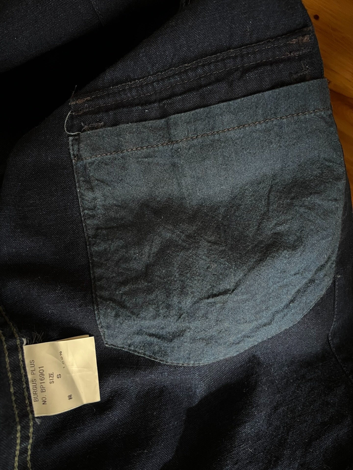 blue dyed work jacket with gem buttons