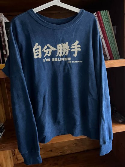 blue denim wash sweatshirt with text
