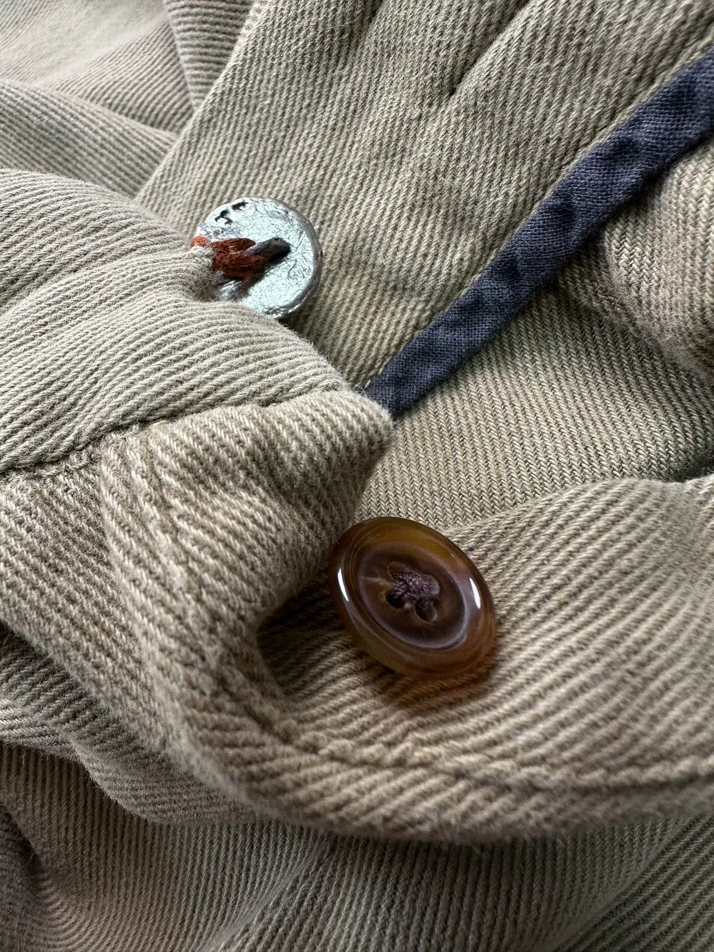 beige velvet overalls with silver buckles