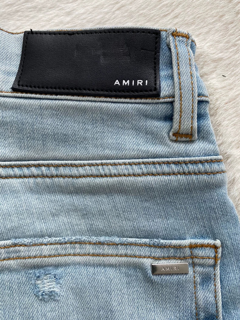 Amiri Distressed Logo Applique Denim Pants