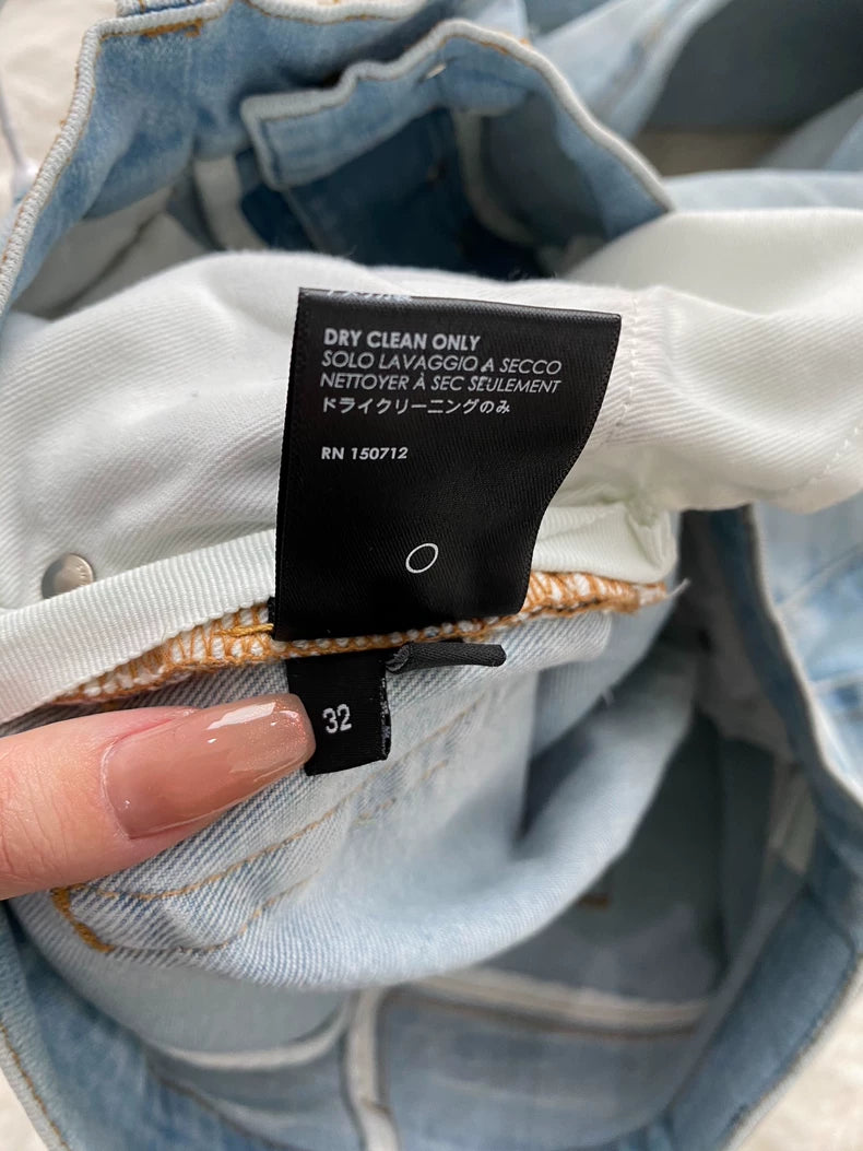 Amiri Distressed Logo Applique Denim Pants