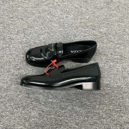 Prada Triangle Loafers in Black