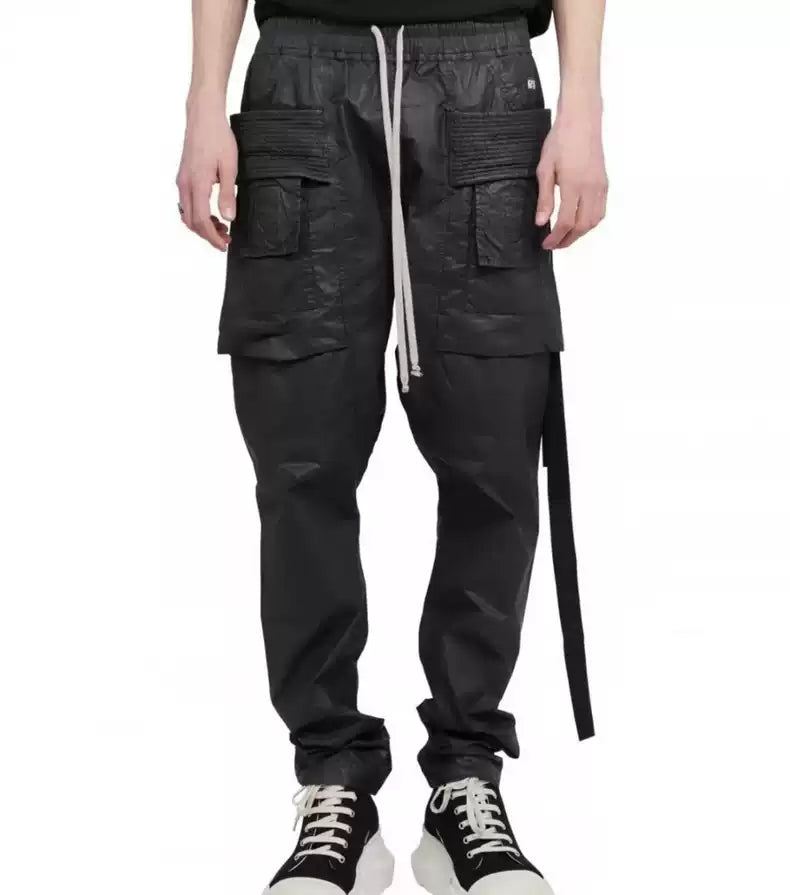 Rick Owens Wax glossy double-ring trousers with large pockets and drawstring.