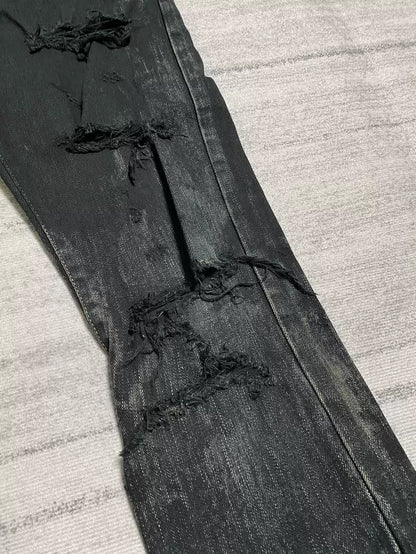 Saint Laurent oil pollution destroys jeans.