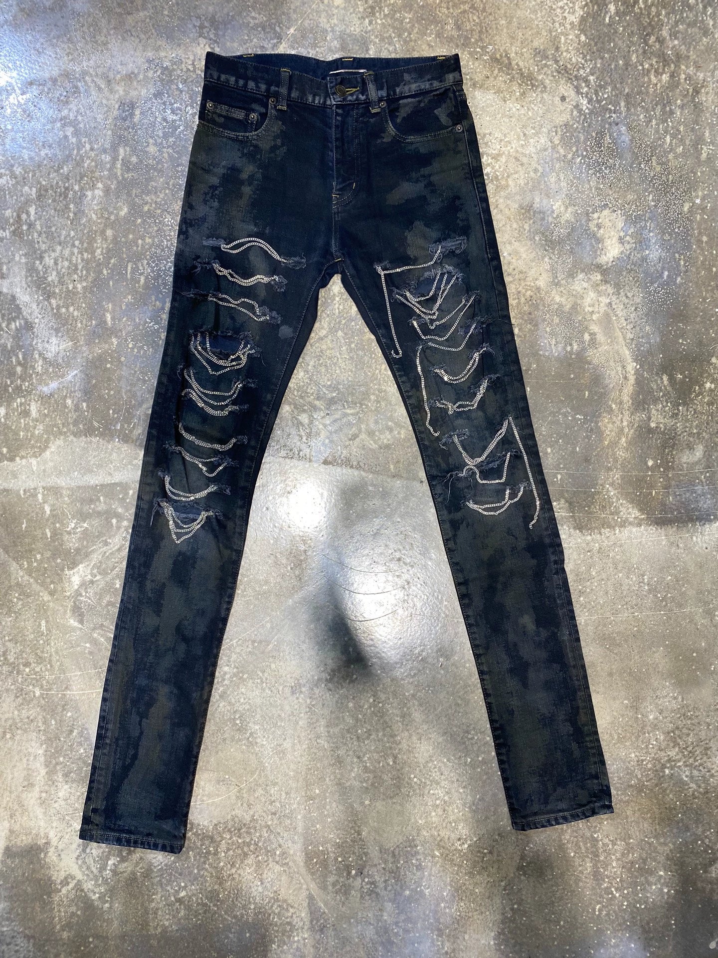 Saint Laurent Paris Washing heavily damages oily jeans