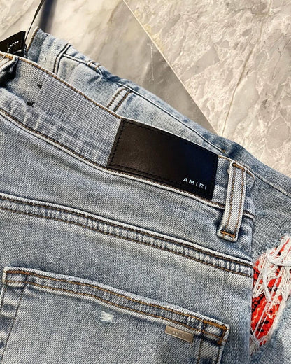 Amiri Wash Blue Orange Print Denim Pants