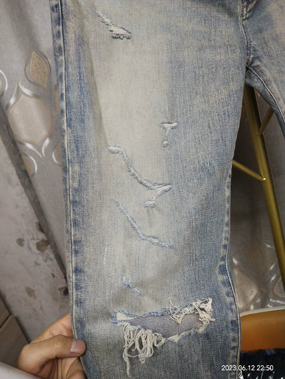Saint Laurent Distressed Denim Jeans