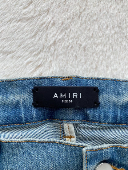 Amiri Distressed Denim Pants with Patches