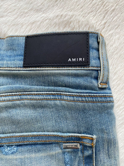 Amiri Distressed Denim Pants with Patches