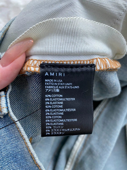 Amiri Distressed Denim Pants with Patches