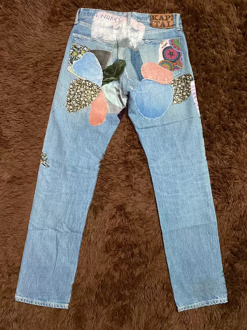 kapital Patched jeans with flowers and random stitches