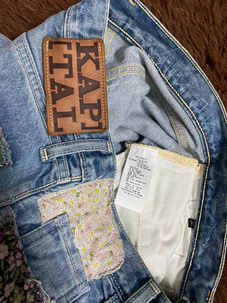 kapital Patched jeans with flowers and random stitches