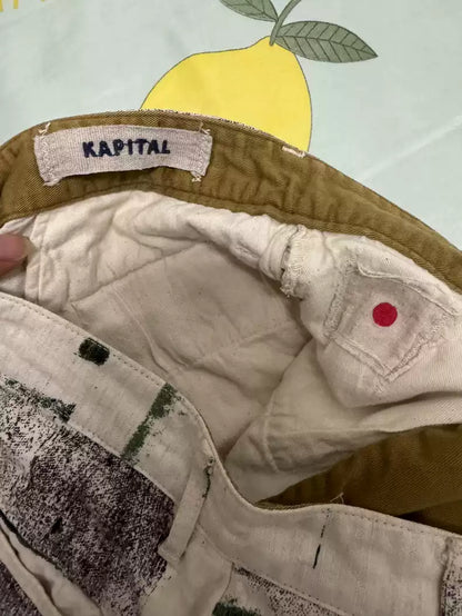 kapital Graffiti to make old slogan printed linen shorts